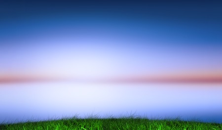 Digitally generated green grass under blue and purple skyの写真素材