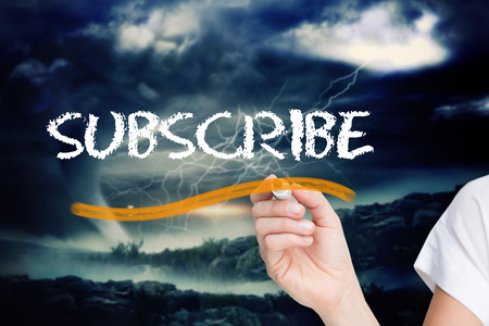 Businesswoman writing the word subscribe against stormy sky with tornado over landscape