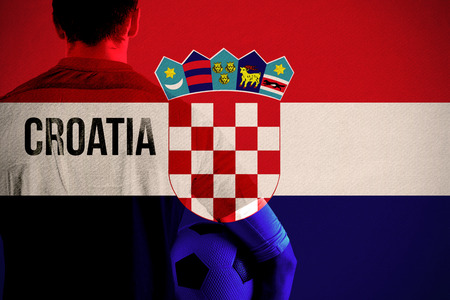 Croatia football player holding ball against croatia national flagの写真素材
