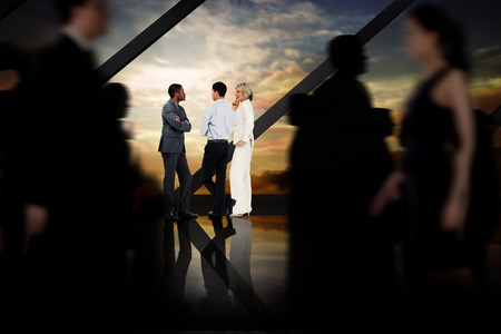 Business people walking in a blur against room with large window looking on landscapeの写真素材