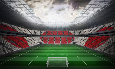 Digitally generated japan national flag against football stadiumの写真素材