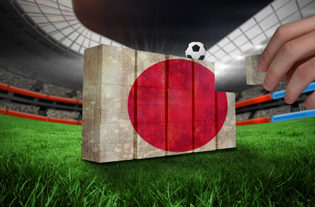 Hand building wall of  japan flag in grunge effectの写真素材