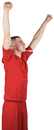 Excited football player cheering on white background
