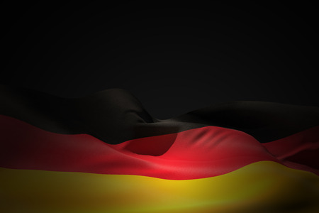Germany flag waving against black shadowの写真素材