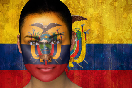 Composite image of beautiful football fan in face paint against ecuador flag in grunge effectの写真素材