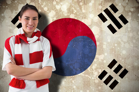 Football fan in white wearing scarf against south korea flagの写真素材