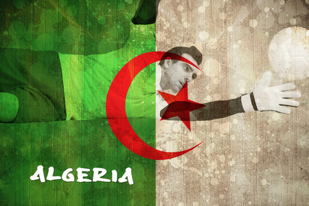 Goalkeeper in white making a save against algeria flag in grunge effectの写真素材