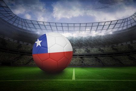 Football in chile colours in large football stadium with lightsの写真素材