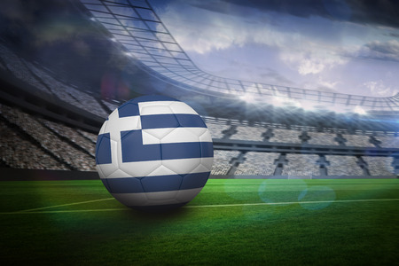 Football in greece colours in large football stadium with lightsの写真素材