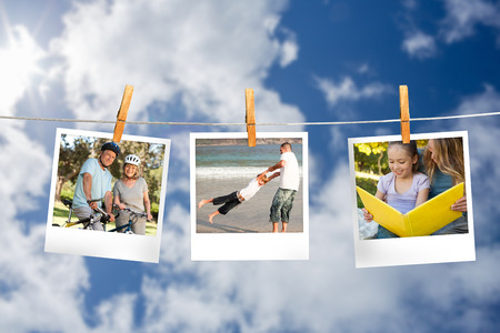 Composite image of instant photos hanging on a line against cloudy sky