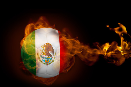 Composite image of fire surrounding mexico ball against blackの写真素材