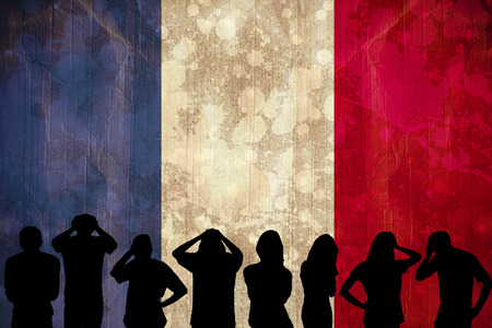 Silhouettes of football supporters against france flag in grunge effectの写真素材