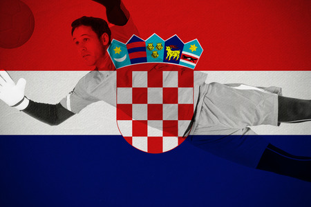 Fit goal keeper jumping up against croatia national flagの写真素材