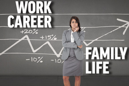 Composite image of focused businesswoman against black wallの写真素材