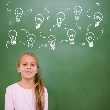 Composite image of idea and innovation graphic against cute pupilの写真素材