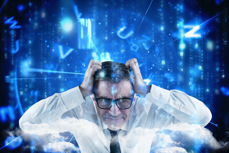 Stressed businessman touching his head against lines of blue blurred letters fallingの写真素材