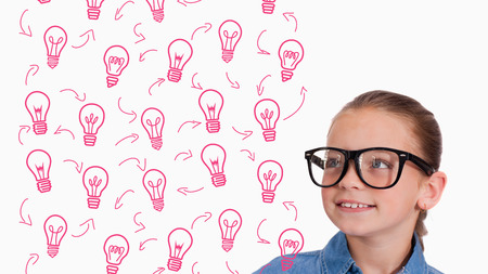 Cute pupil smiling against idea and innovation graphicの写真素材