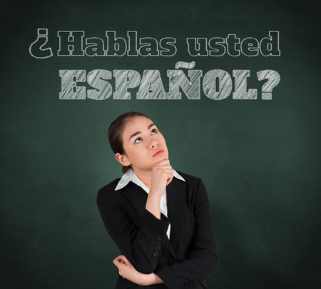 Composite image of businesswoman thinking against green chalkboardの写真素材