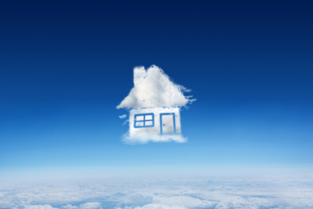 Cloud house against blue sky over clouds at high altitudeの写真素材