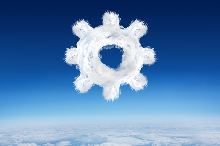 Cloud cog against blue sky over clouds at high altitudeの写真素材
