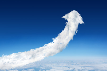 Cloud arrow against blue sky over clouds at high altitude