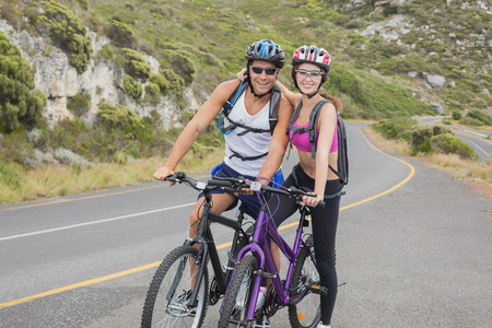 Portrait of an athletic couple mountain bikingの写真素材