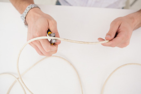 Computer engineer working on broken cables in his office