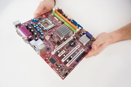 Computer engineer working on broken cpu in his office