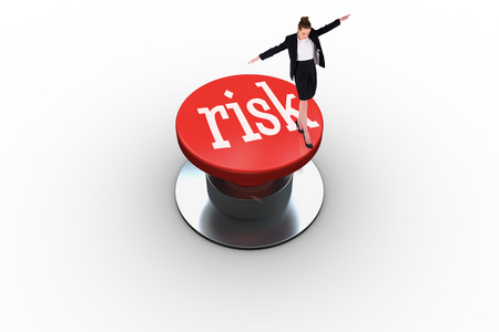 The word risk and businesswoman performing a balancing act against white background