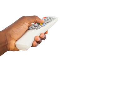 Mans hand holding remote control on white backgroundの写真素材