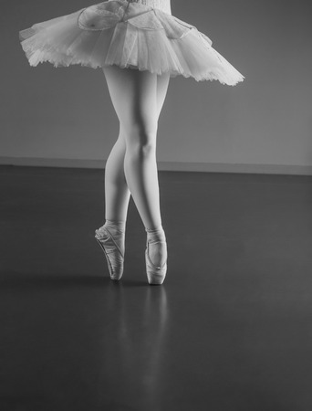 Graceful ballerina standing en pointe in the ballet studioの写真素材
