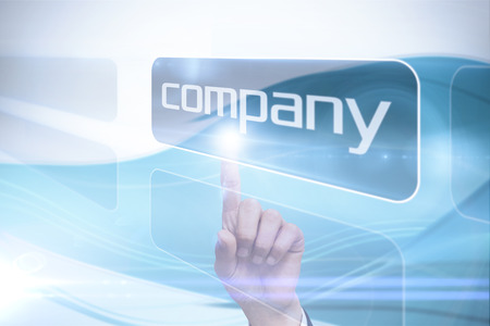 Businessman pointing to word company against futuristic blue and white backgroundの写真素材