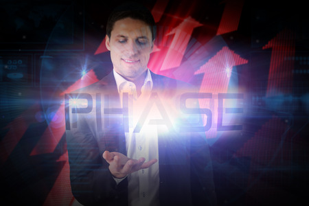 Businessman presenting the word phase against shiny red arrows on black backgroundの写真素材
