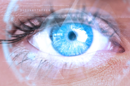 Composite image of close up of female blue eye against triangle designの写真素材