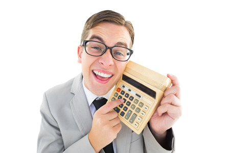 Geeky smiling businessman showing calculator on white backgroundの写真素材