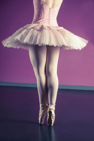 Graceful ballerina standing en pointe in the ballet studioの写真素材