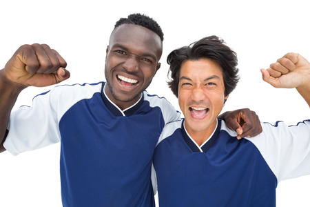 Football players celebrating a win over white backgroundの写真素材