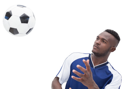 View of football player playing over white backgroundの写真素材