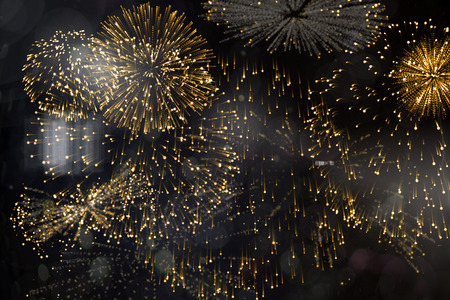 Digitally generated colourful fireworks exploding on black background