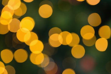Blurry yellow christmas light circles close upの写真素材