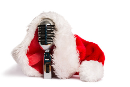 Vintage mic with santa hat on white backgroundの写真素材