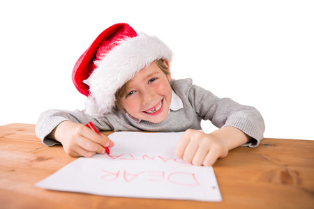 Child writing letter to santa at the deskの写真素材