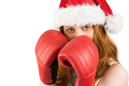 Festive redhead with boxing gloves on white backgroundの写真素材