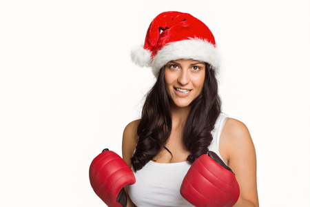 Woman wearing red boxing gloves on white backgroundの写真素材