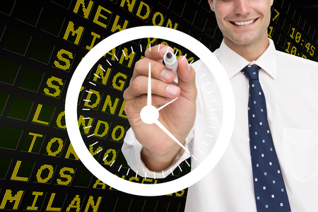 Composite image of business person drawing a white clockの写真素材