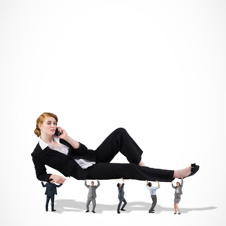 Business team supporting boss against white backgroundの写真素材