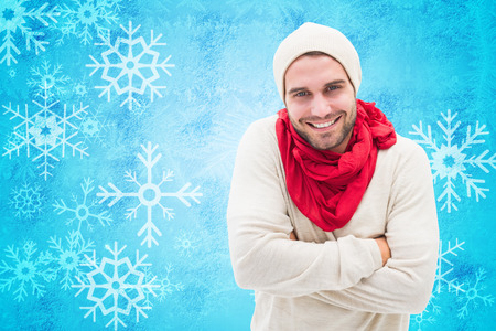 Handsome hipster against blue snow flake pattern designの写真素材