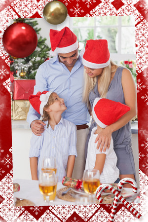 Composite image of happy family at christmas against christmas themed pageの写真素材