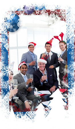 Business people with novelty Christmas hat toasting at a party against christmas themed frameの写真素材