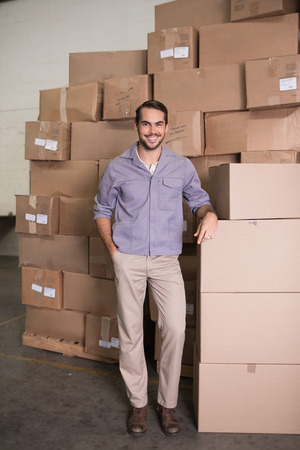 Portrait of manual worker standing in the warehouseの写真素材